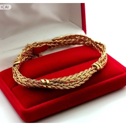 Złota bransoletka UNOAERRE plecione kłosy Pr.375 W:18,71gr Dł:19cm Szer.1cm